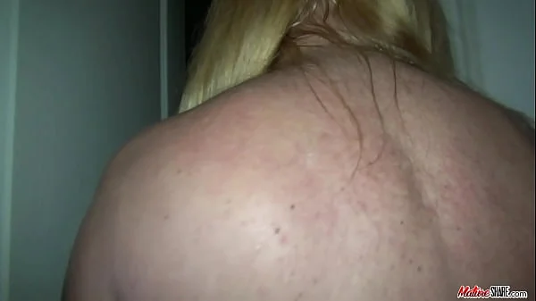 Busty granny loves flashing naked around the house