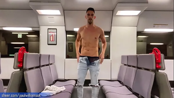 Sexy tanned man travelling naked by train. Very risky public nudity