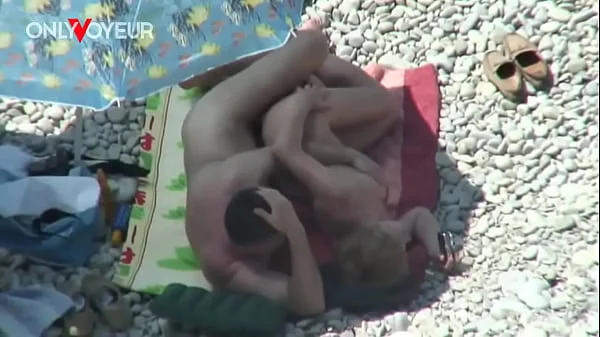 Beach Voyeur. Mature couple fucking under the shining sun