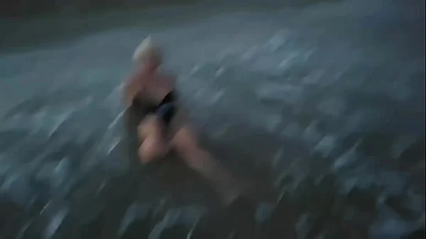 Blonde shows tits and sucks cock on a public beach