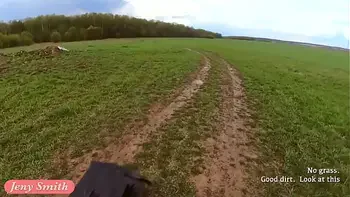 Naked woman riding a Dirt Bike