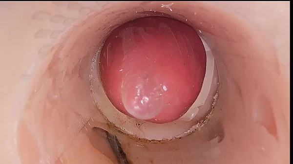 The camera in the deep pussy records a huge ejaculation of sperm into the condom