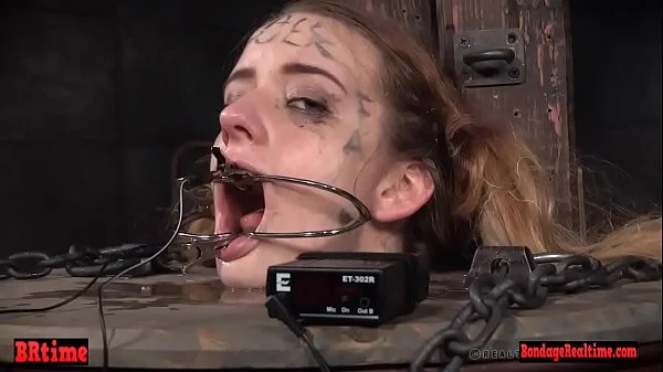 Bdsm babe trapped in a barrel and electrified