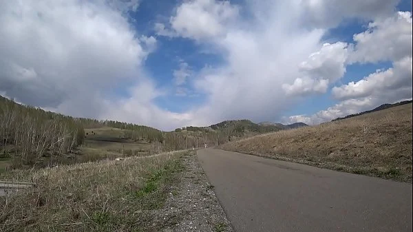 Outdoor exhibitionism. A completely naked babe with a sexy figure, juicy PAWG, and hairy pussy walks in high-heeled sandals on the road. Amateur fetish.