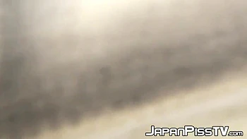 Naughty Japanese Rubs Her Yummy Pussy While Peeing