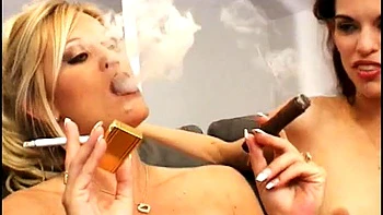 Two smoking hotties sharing a cock