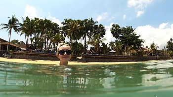 Lovita Fate, sexy angel in bikini by the pool