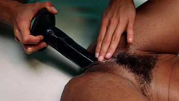 Scarlit Scandal and Cecilia Lion are having fun with a strapon together