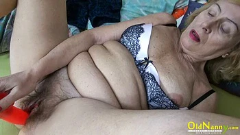 Stunning mature hottie with hairy pussy Emmy plays with a dildo