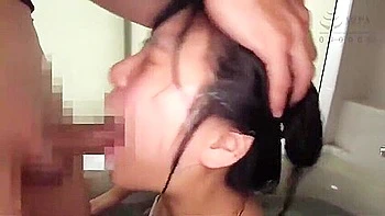 A dildo is thrust deep into her throat and a vibrator is inserted.