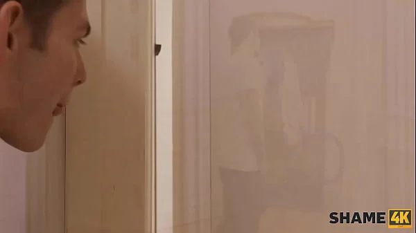SHAME4K. Perv jerks off peeping on MILF in bathroom and she catches him