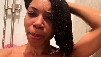 Ebony babe with big tits takes shower solo